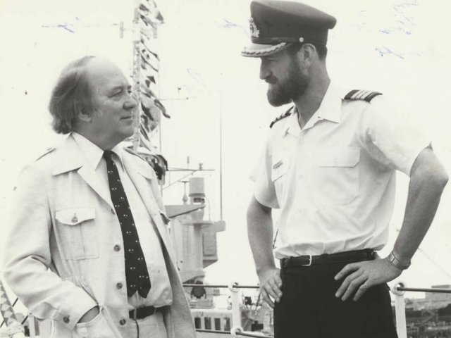 With the captain of HMCS Algonquin, which is dressed overall in honour of Douglas Reeman's visit, in Halifax, Nova Scotia.