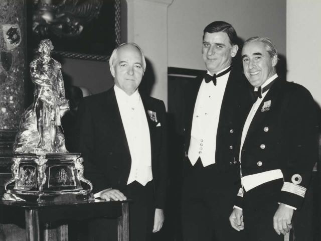 Guest of honour at the Trafalgar Night Dinner, HMS Nelson, Portsmouth, 1983, with the Commodore (right) and Commander (president of the wardroom mess).